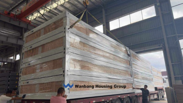 Flat-pack container houses loaded into a 40HQ container for export from China — Wanbang